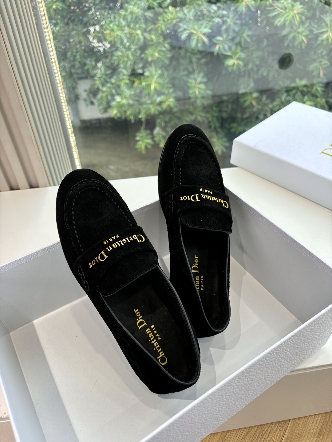 A pair of Christian Dior black suede loafers with gold signature logo in a white luxury box - Hình 2