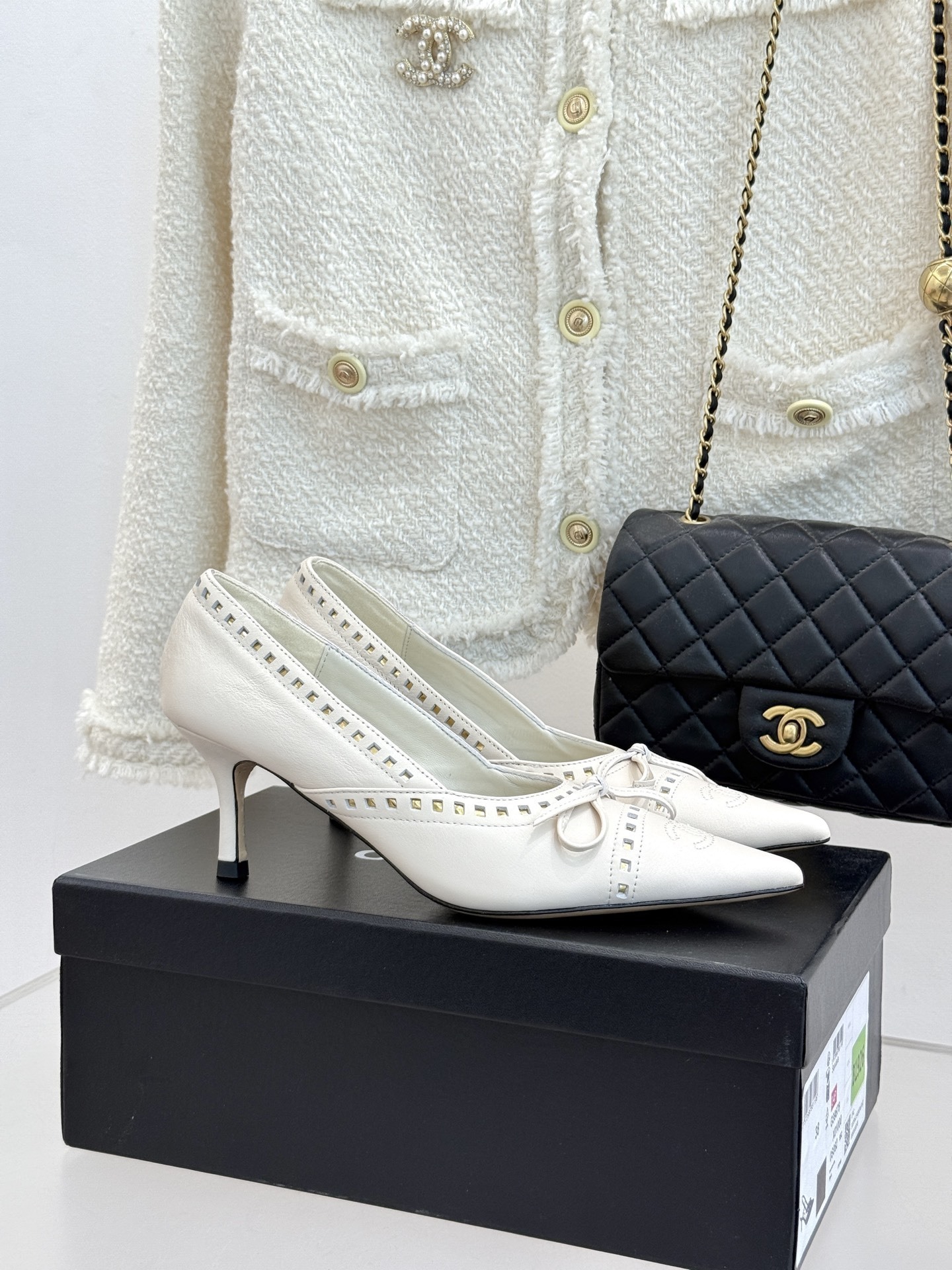 Chanel Elegant White Leather Pointed Toe Pumps with Bow & CC Logo