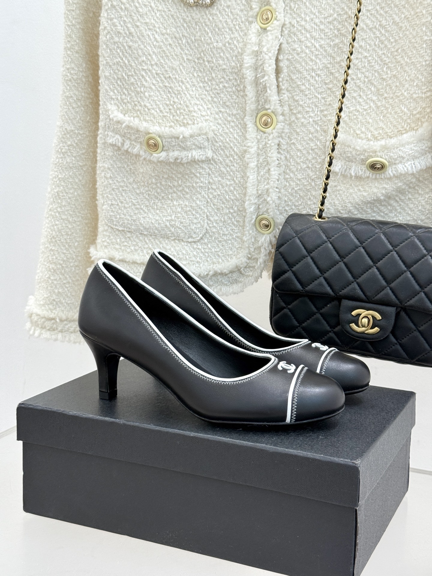 Chanel Black Leather Kitten Heel Pumps with White Trim & CC Logo