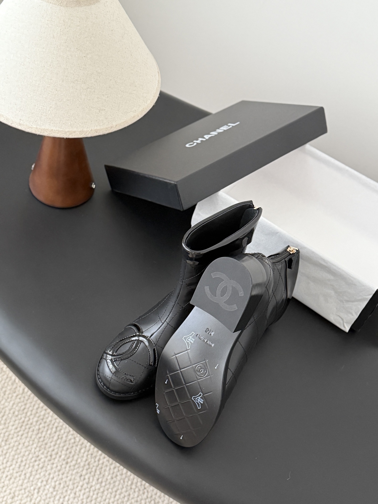 Pair of black Chanel quilted leather ankle boots with patent leather CC logo toe caps and back zippers - Hình 5