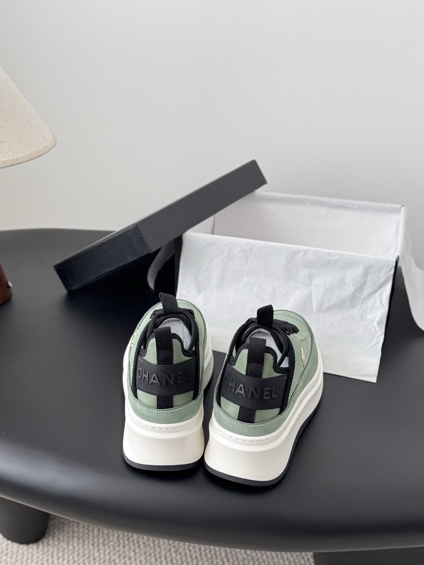 Chanel mint green suede sneakers with chunky white platform soles and black laces next to a Chanel box. - Hình 5