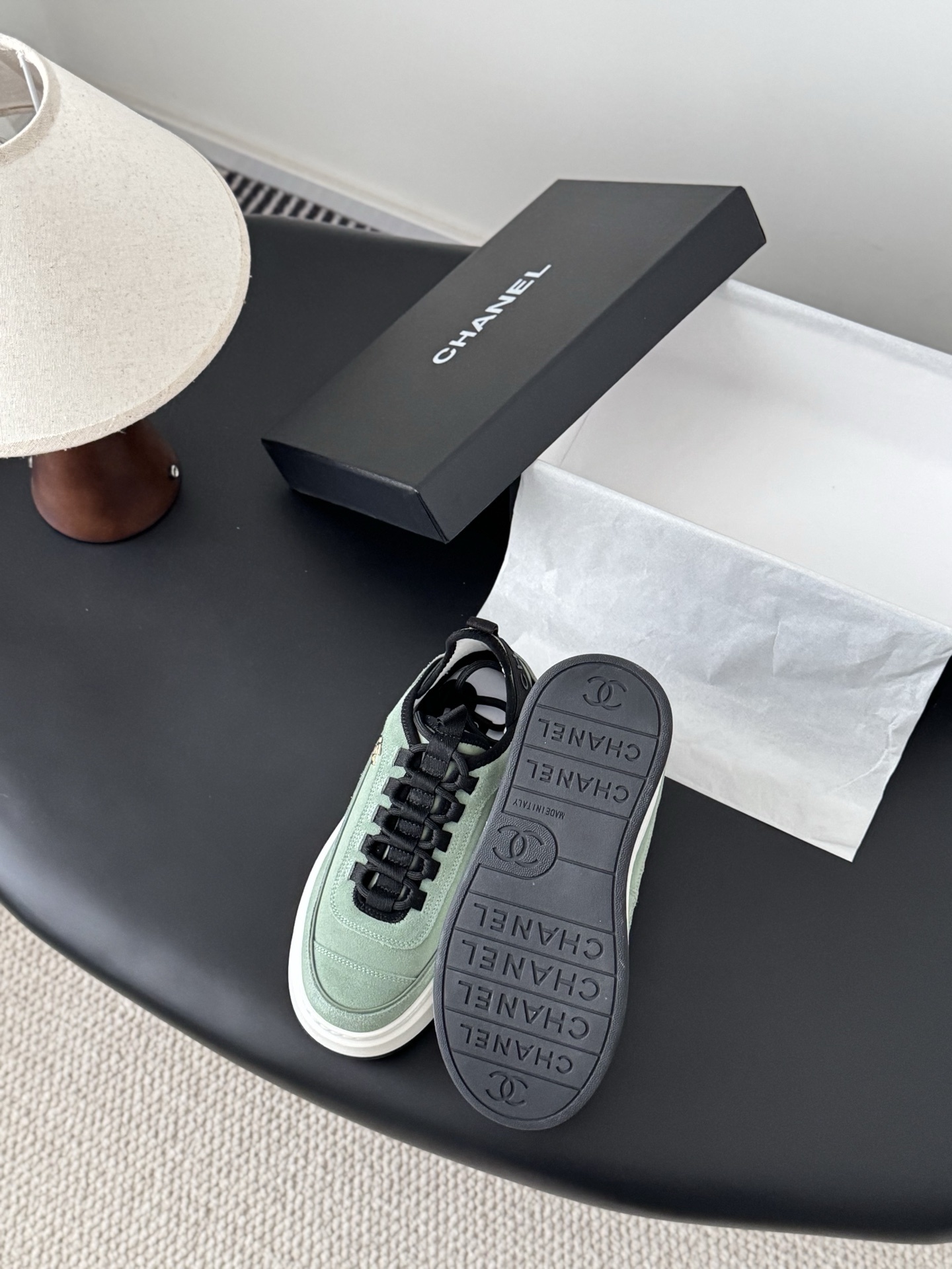 Chanel mint green suede sneakers with chunky white platform soles and black laces next to a Chanel box. - Hình 4