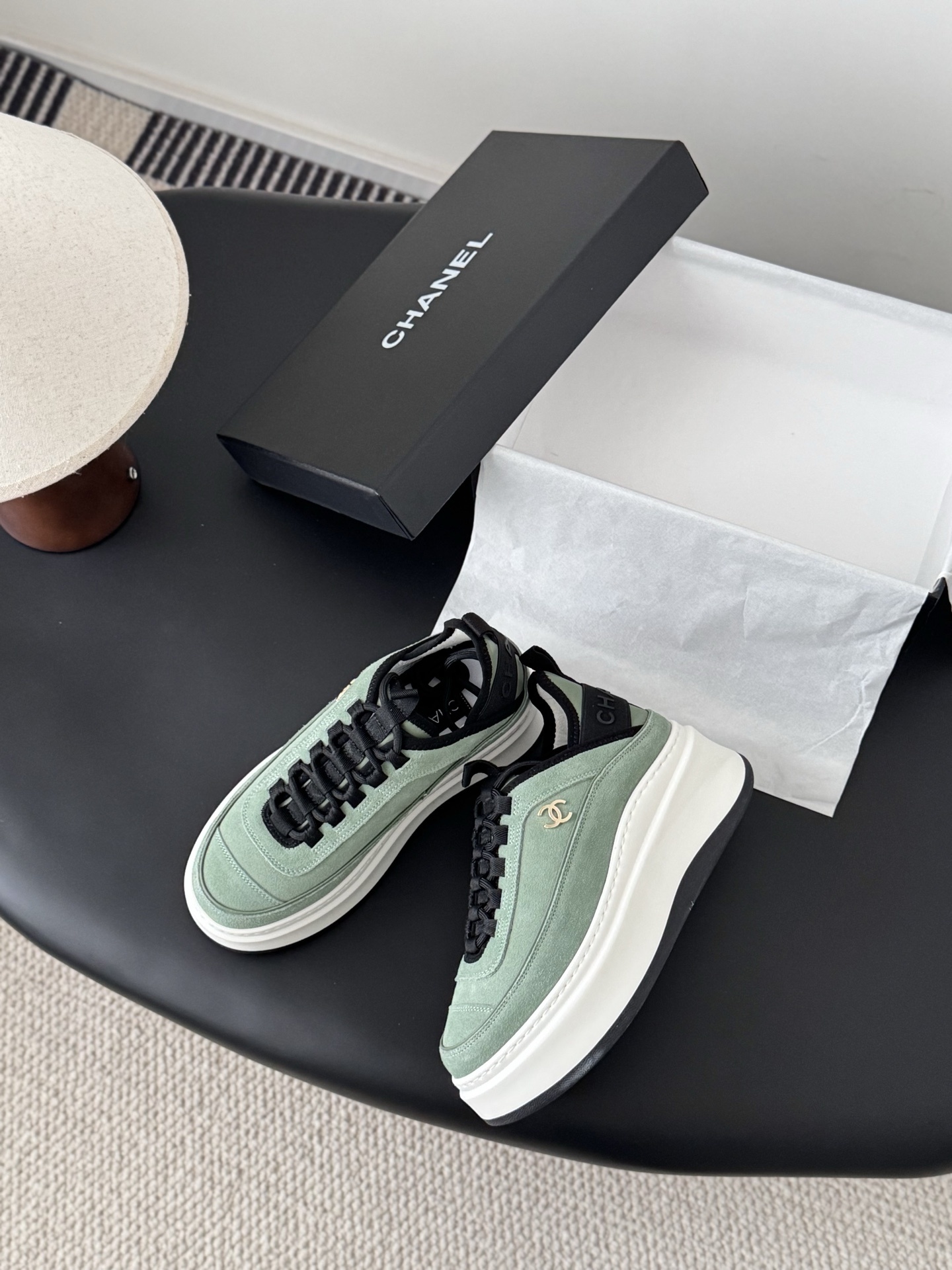 Chanel mint green suede sneakers with chunky white platform soles and black laces next to a Chanel box. - Hình 3