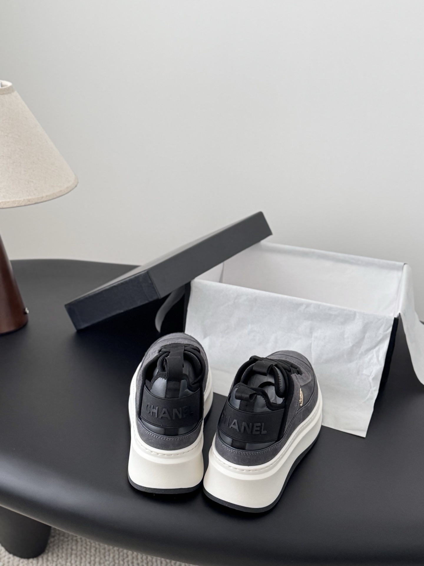 Luxury Chanel platform sneakers in grey suede with white chunky soles and gold CC logo, shown with original black box. - Hình 5