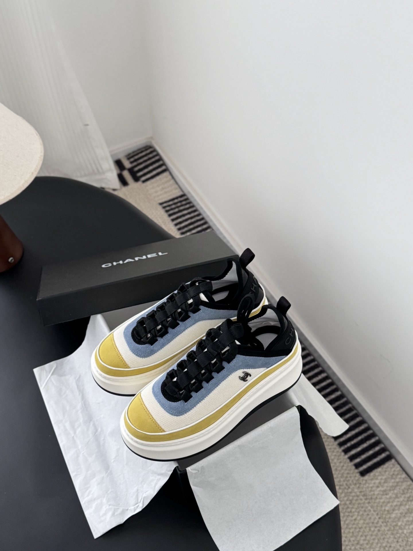 Pair of Chanel multi-color platform sneakers in yellow, blue, and white with black laces and CC logo next to original box - Hình 6