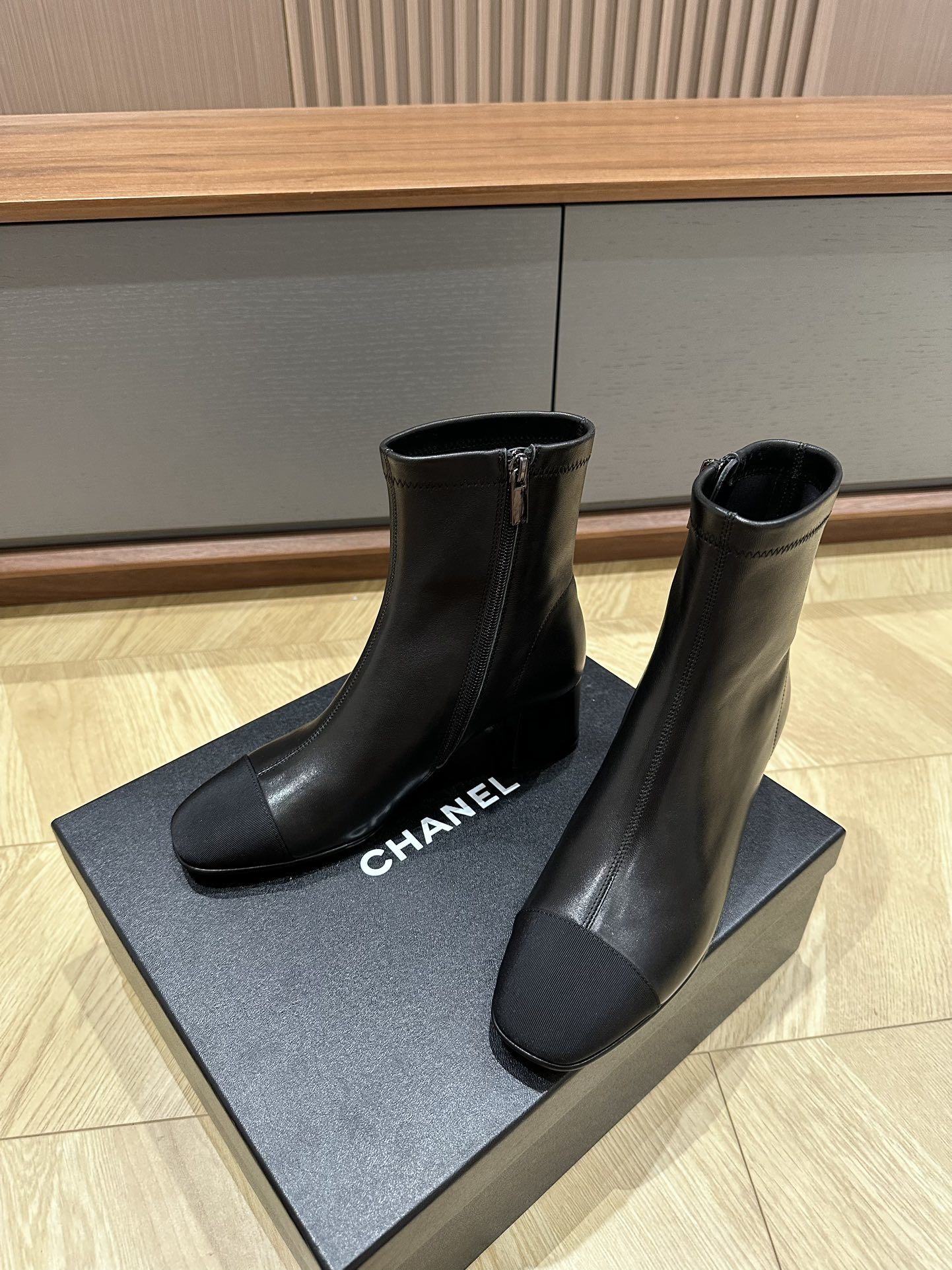 Chanel Black Leather Ankle Boots with Cap Toe and Block Heel