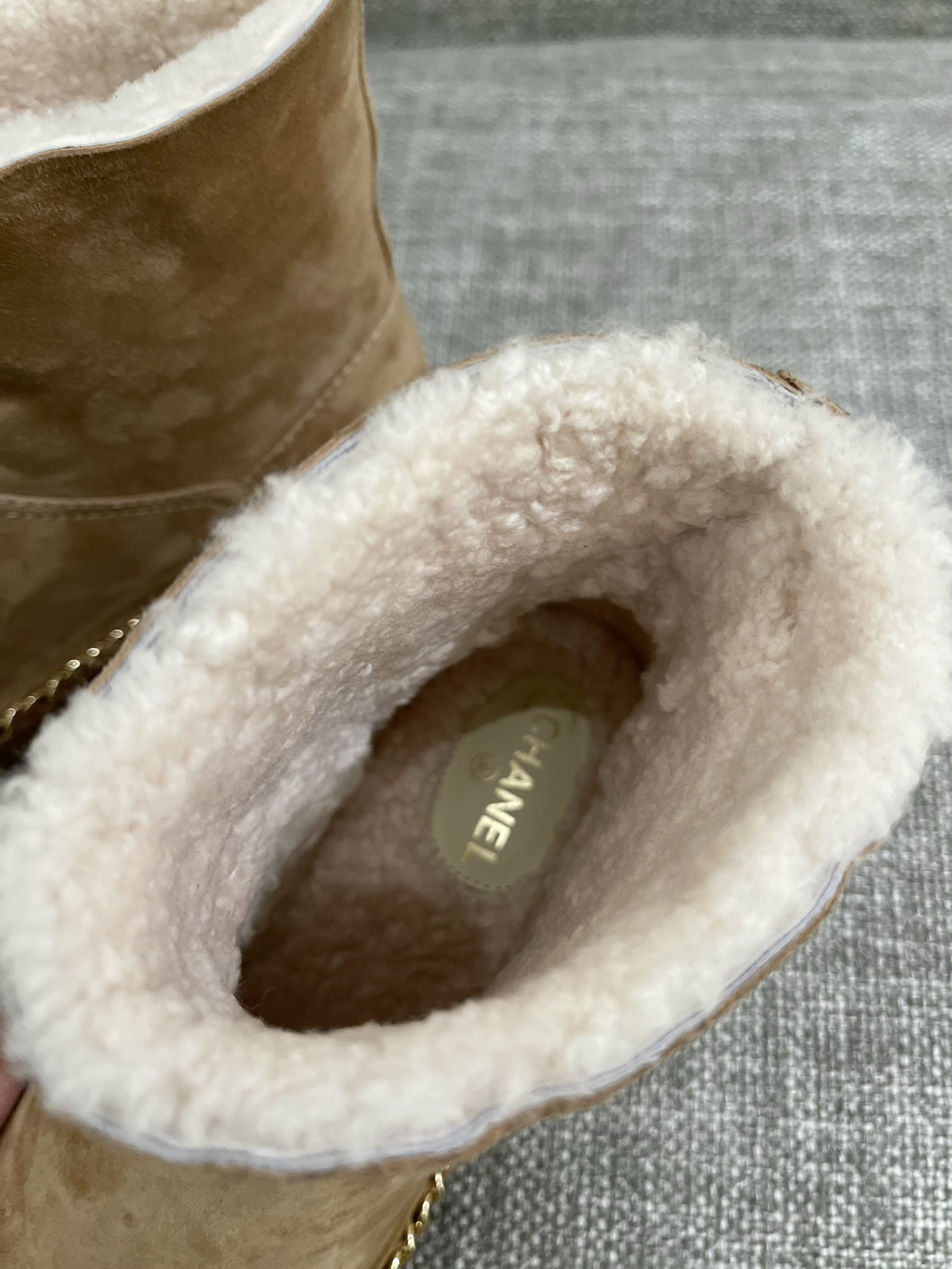 Pair of Chanel tan suede ankle boots with white shearling lining, black cap-toe, and gold chain sole detail. - Hình 8