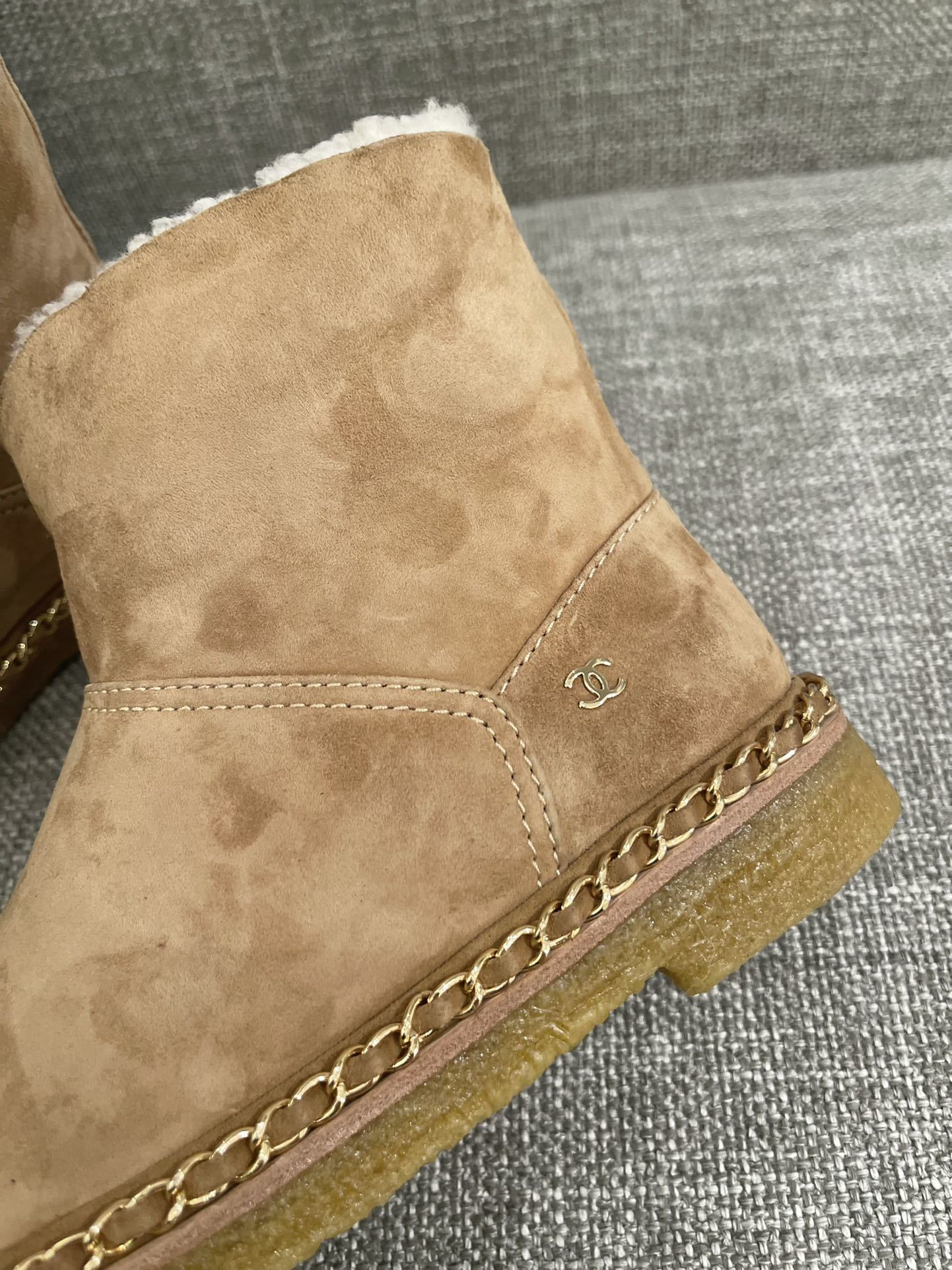 Pair of Chanel tan suede ankle boots with white shearling lining, black cap-toe, and gold chain sole detail. - Hình 6