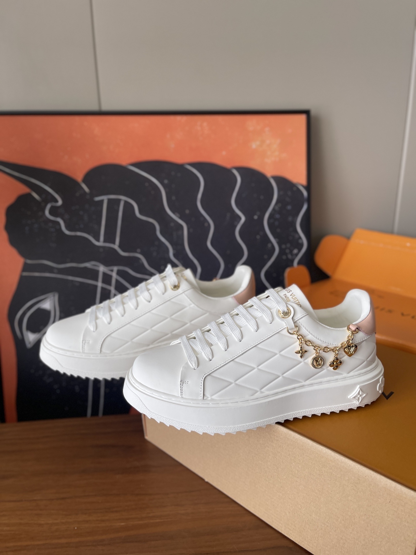 Louis Vuitton Women’s White Quilted Platform Sneakers with Gold Charms