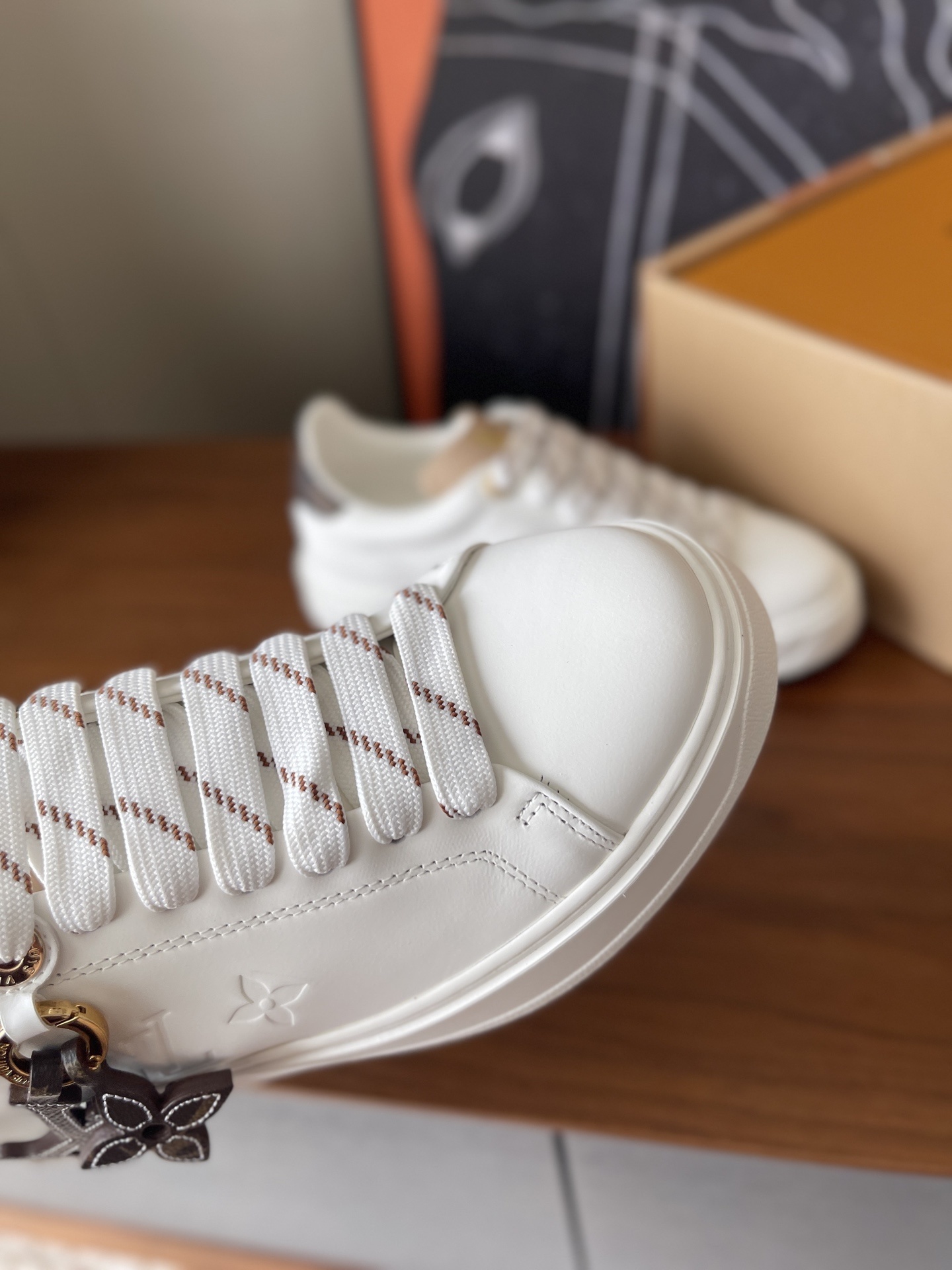 Louis Vuitton Women's White Leather Sneakers with Monogram Charm