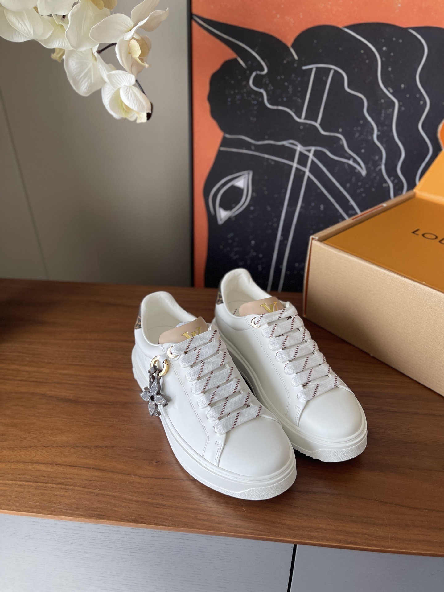 Louis Vuitton Women’s White Leather Sneakers with Monogram Charm