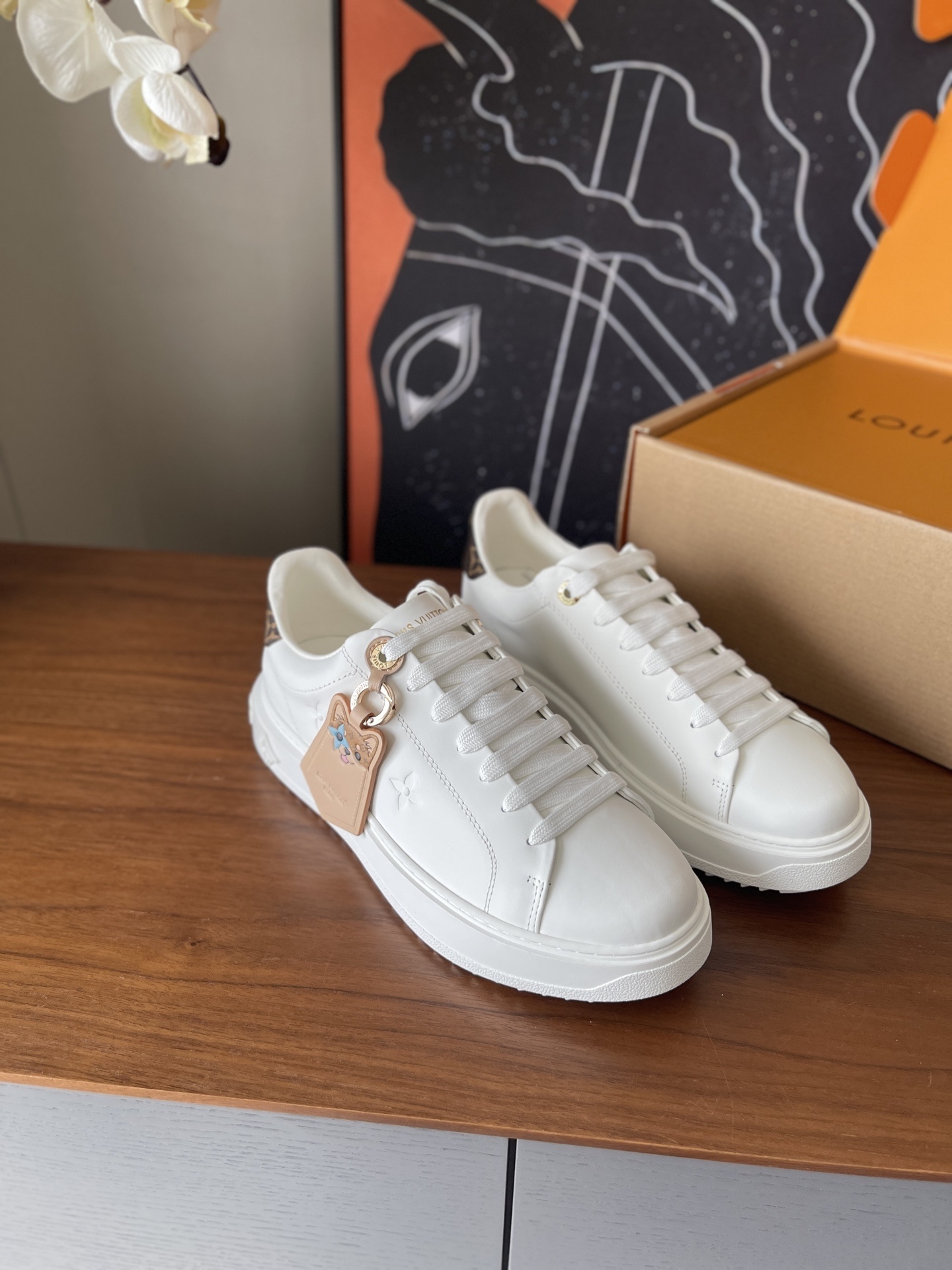 Louis Vuitton Women’s White Leather Monogram Accent Sneakers