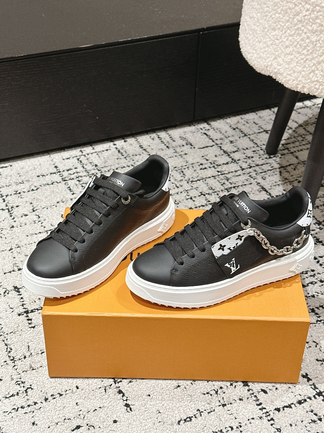 Louis Vuitton Women's Black Leather Sneakers with Gold Chain Detail