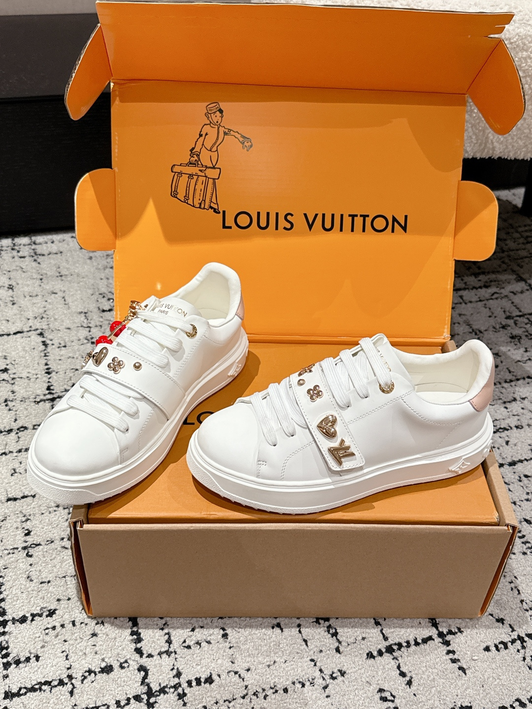 Louis Vuitton White Leather Sneakers with Iconic Gold Charms