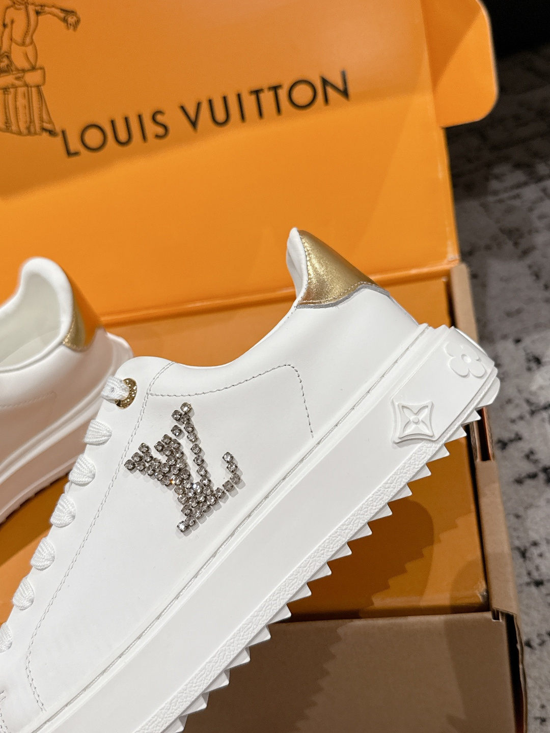 Louis Vuitton Women's White Leather Sneakers with Gold Accents