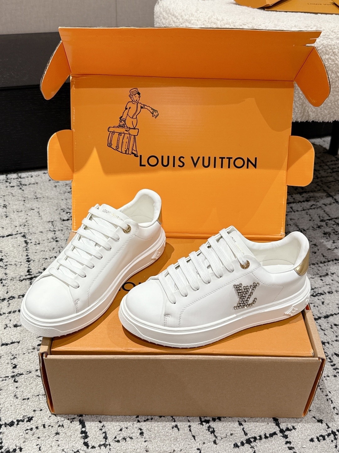 Louis Vuitton Women's White Leather Sneakers with Gold Accents