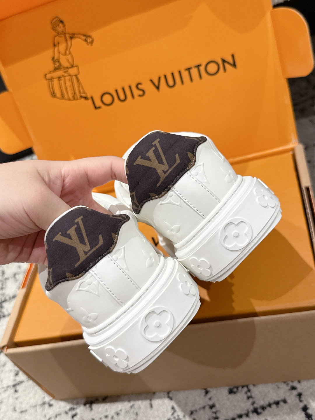 Louis Vuitton Women's White Monogram Embossed Leather Sneakers