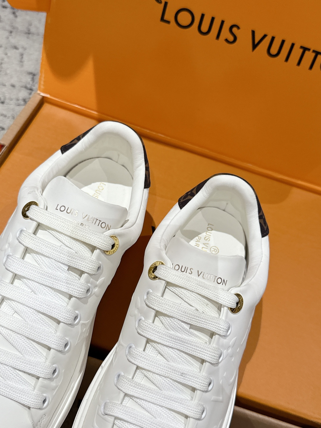 Louis Vuitton Women's White Monogram Embossed Leather Sneakers