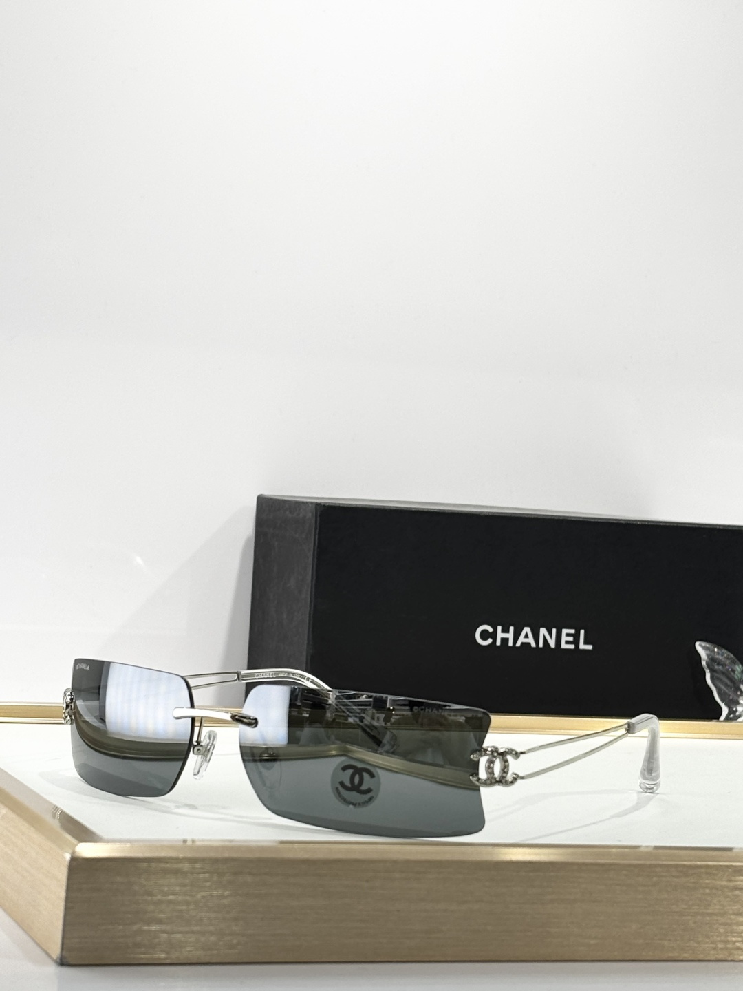 Chanel Luxury Rimless Sunglasses with Crystal CC Logo Temples