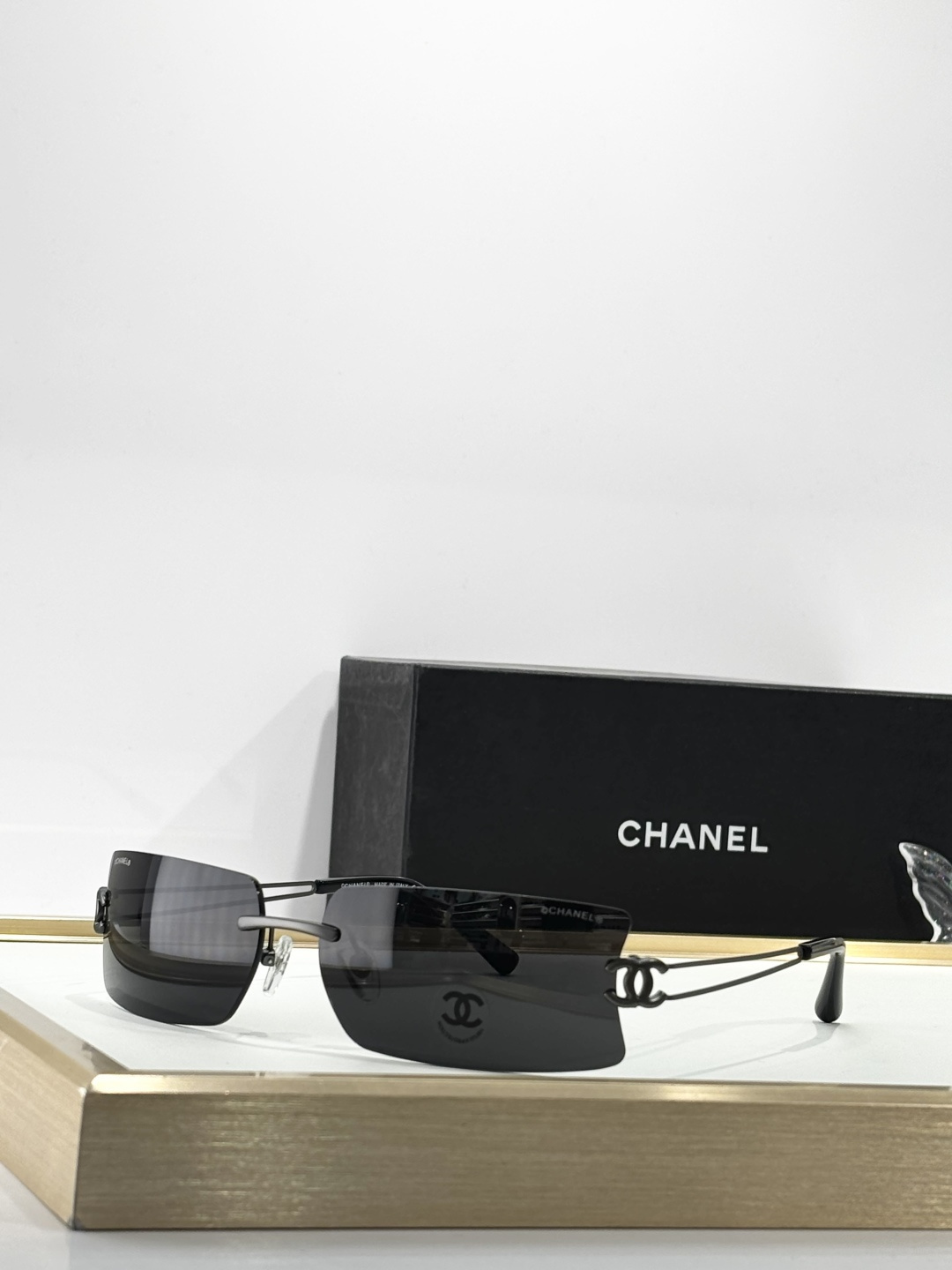 Chanel Luxury Rimless Sunglasses with Crystal CC Logo Temples