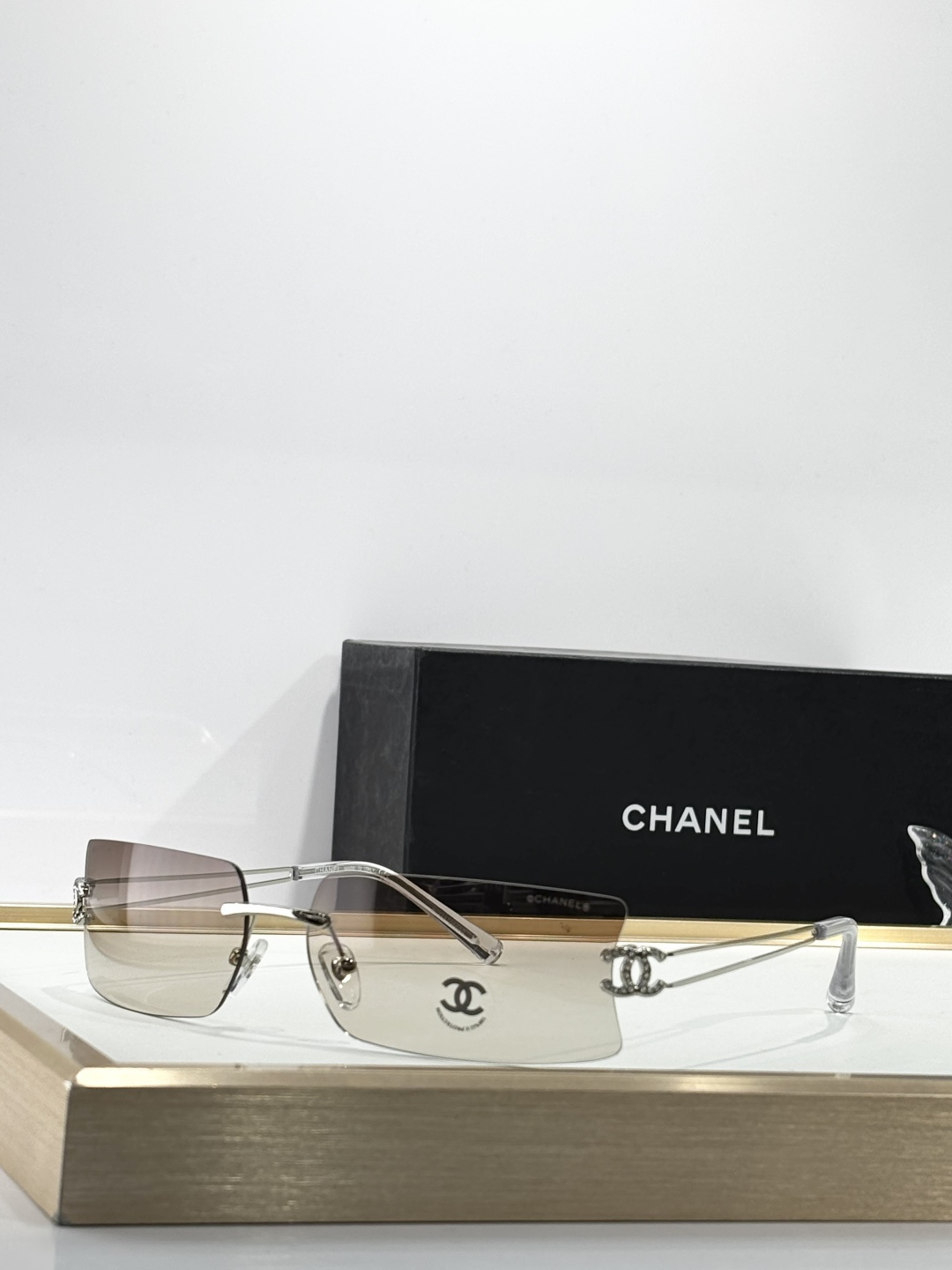 Chanel Luxury Rimless Sunglasses with Crystal CC Logo Temples