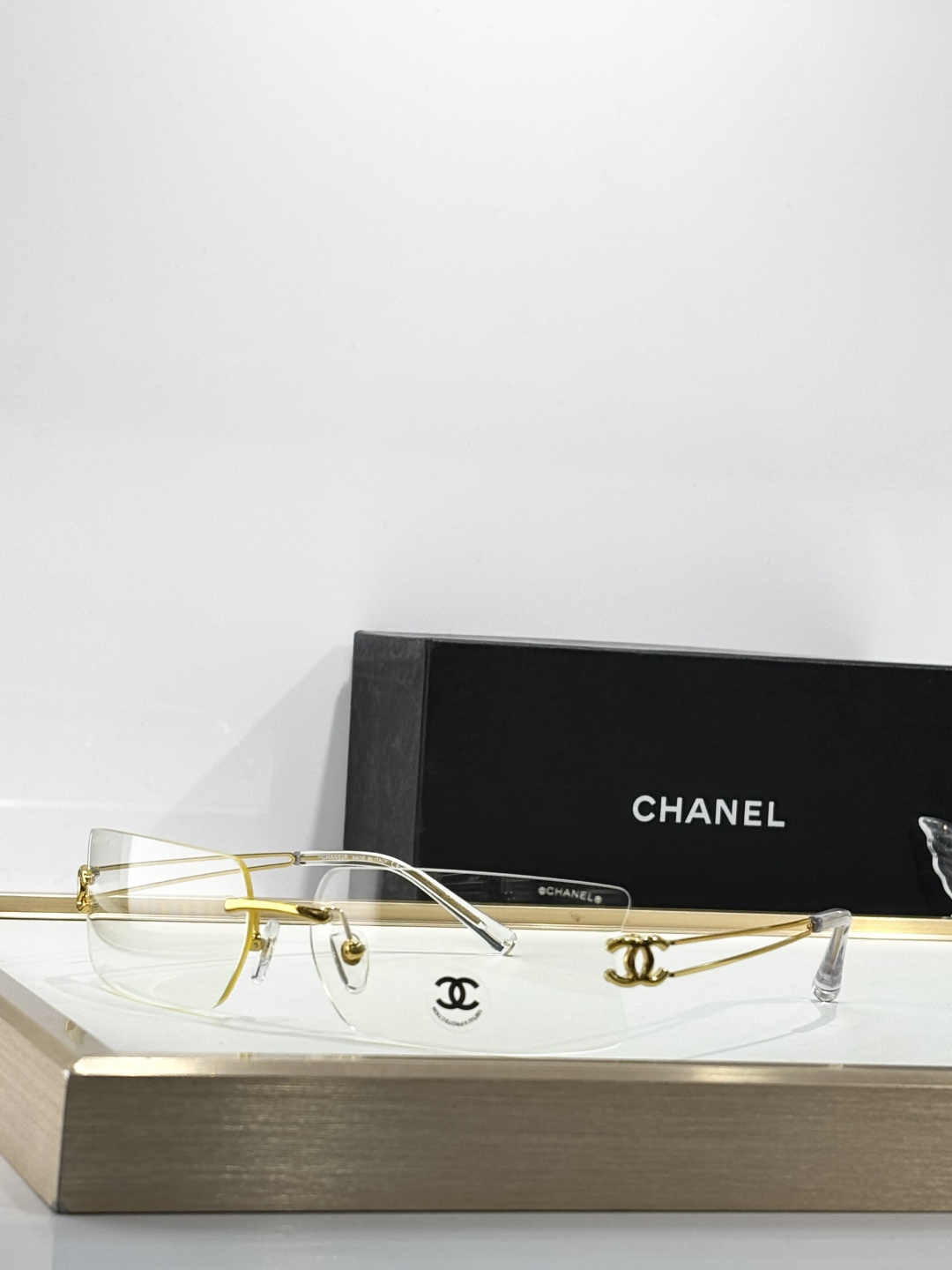 Chanel Luxury Rimless Sunglasses with Crystal CC Logo Temples