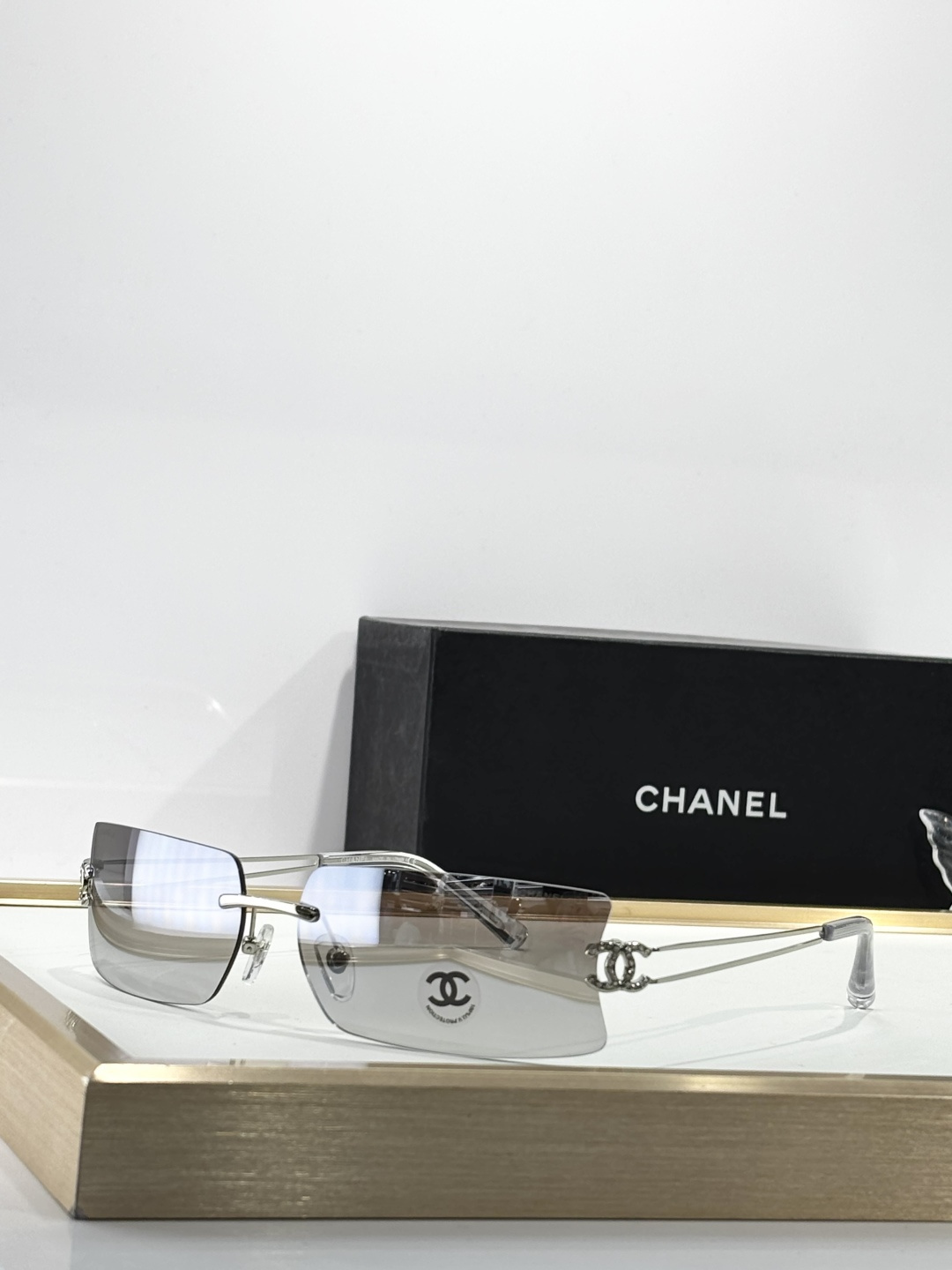 Chanel Luxury Rimless Sunglasses with Crystal CC Logo Temples