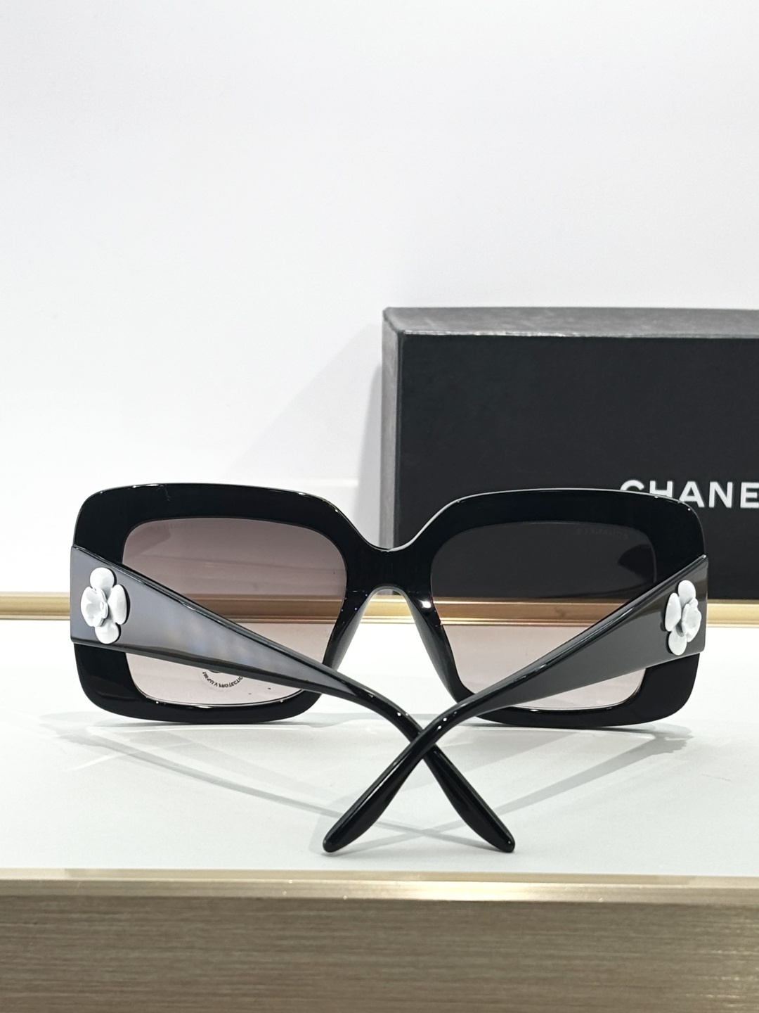 Chanel Luxury Square Sunglasses with White Camellia Detail - Black