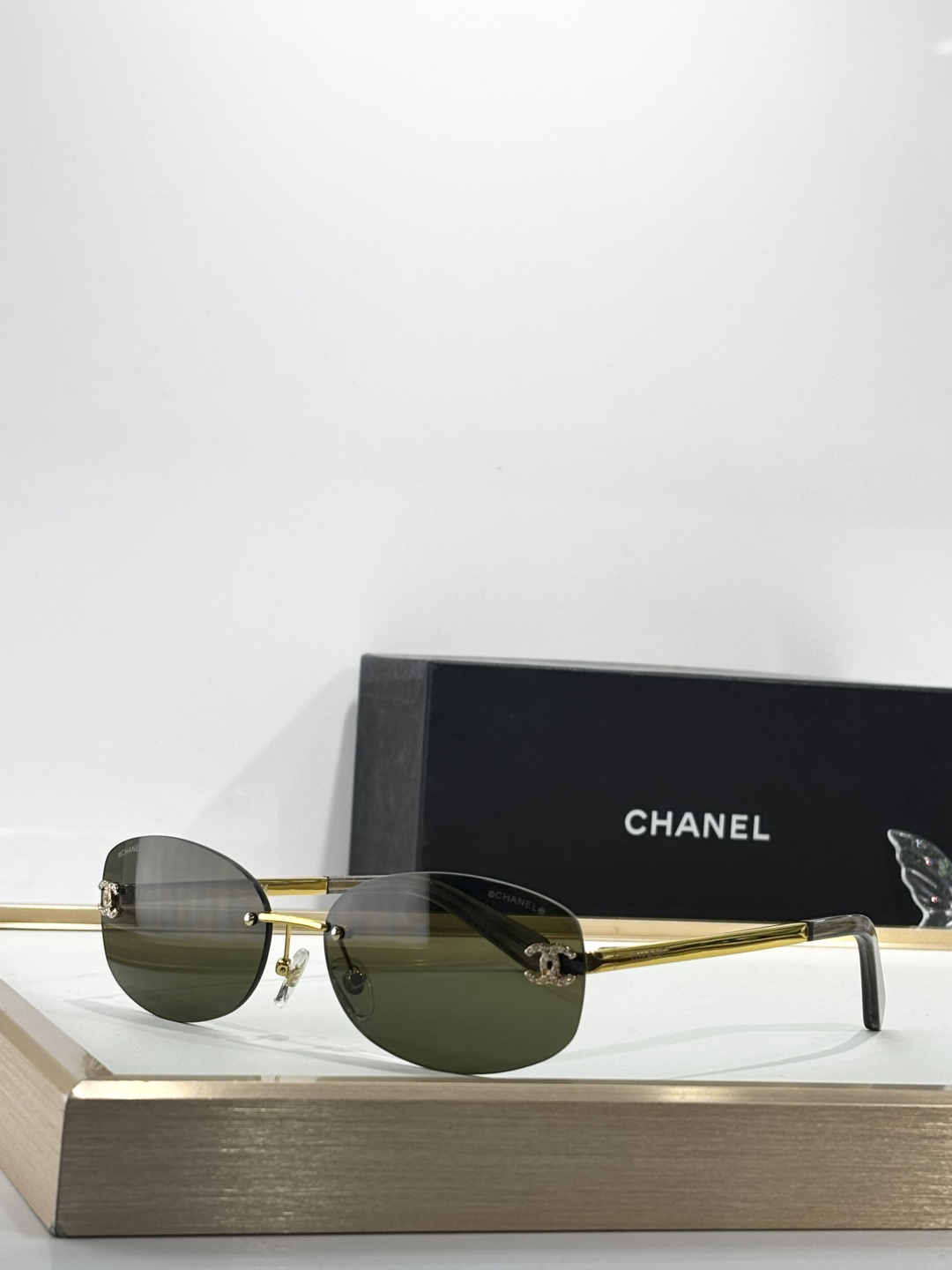 Chanel Rimless Oval Sunglasses with Rhinestone CC Logo