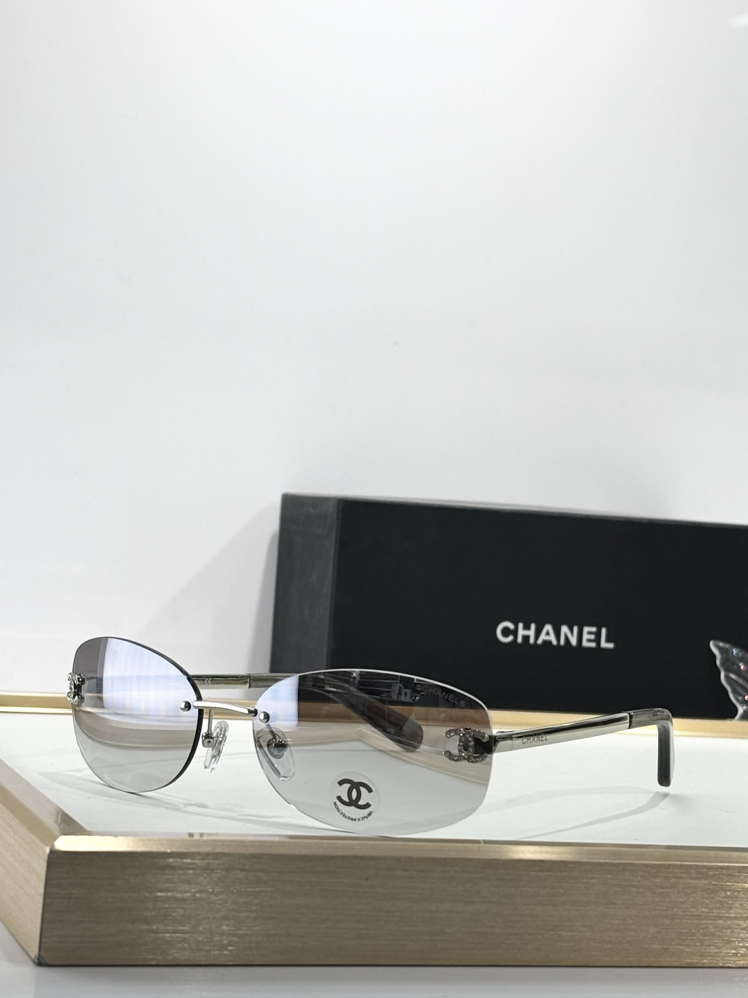 Chanel Rimless Oval Sunglasses with Rhinestone CC Logo