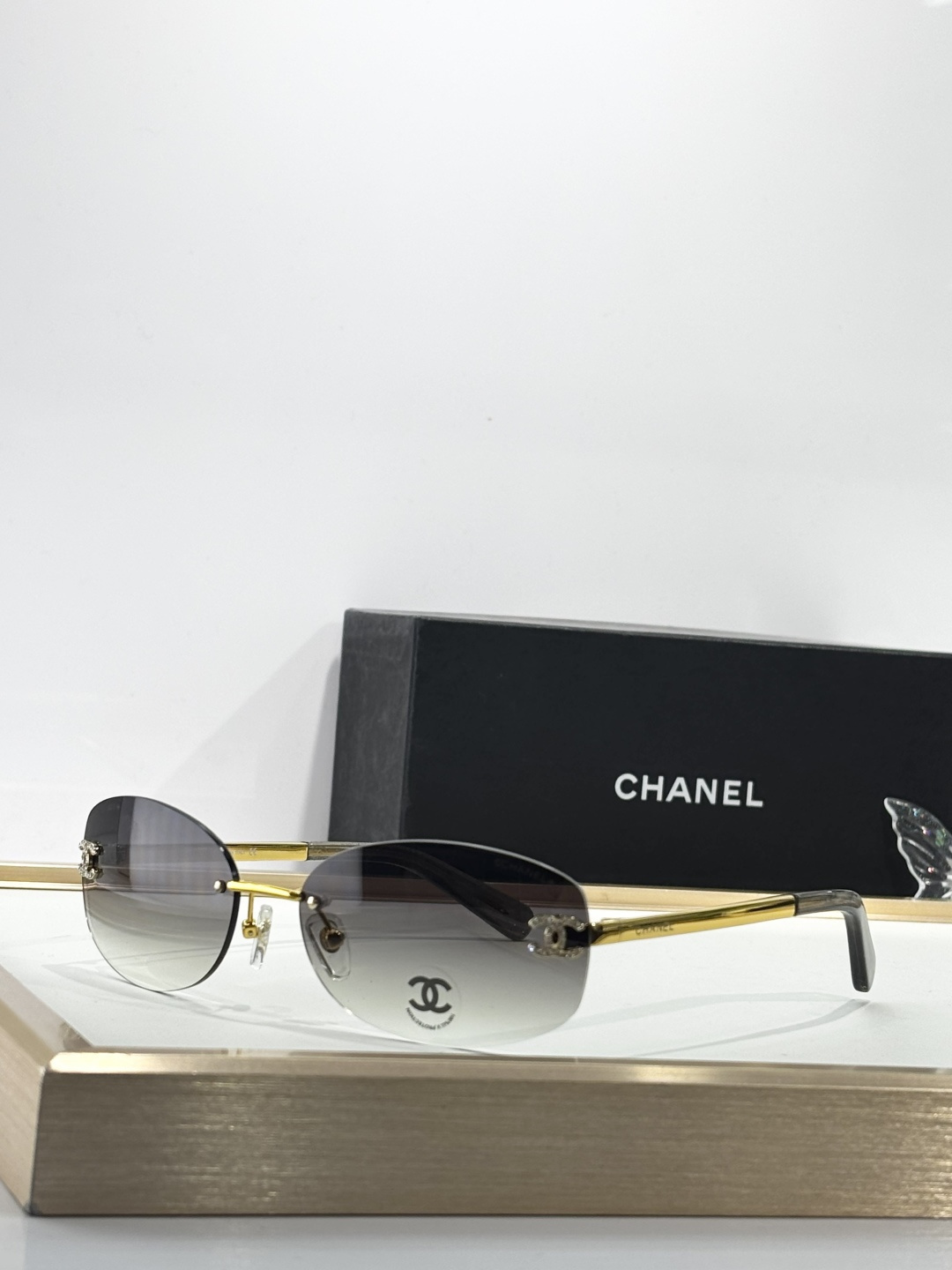 Chanel Rimless Oval Sunglasses with Rhinestone CC Logo