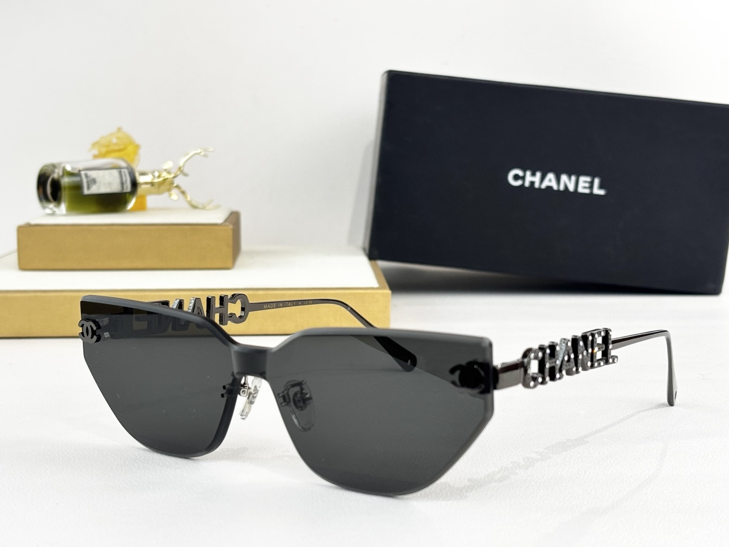 Chanel Luxury Rimless Cat-Eye Sunglasses - Gold Crystal Logo