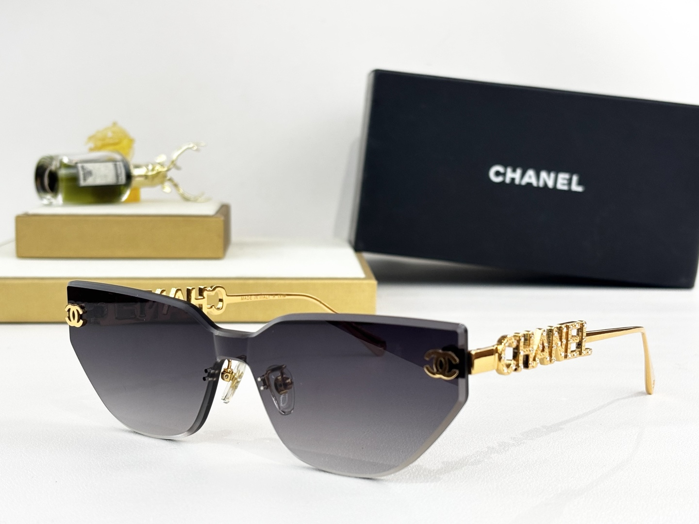 Chanel Luxury Rimless Cat-Eye Sunglasses - Gold Crystal Logo