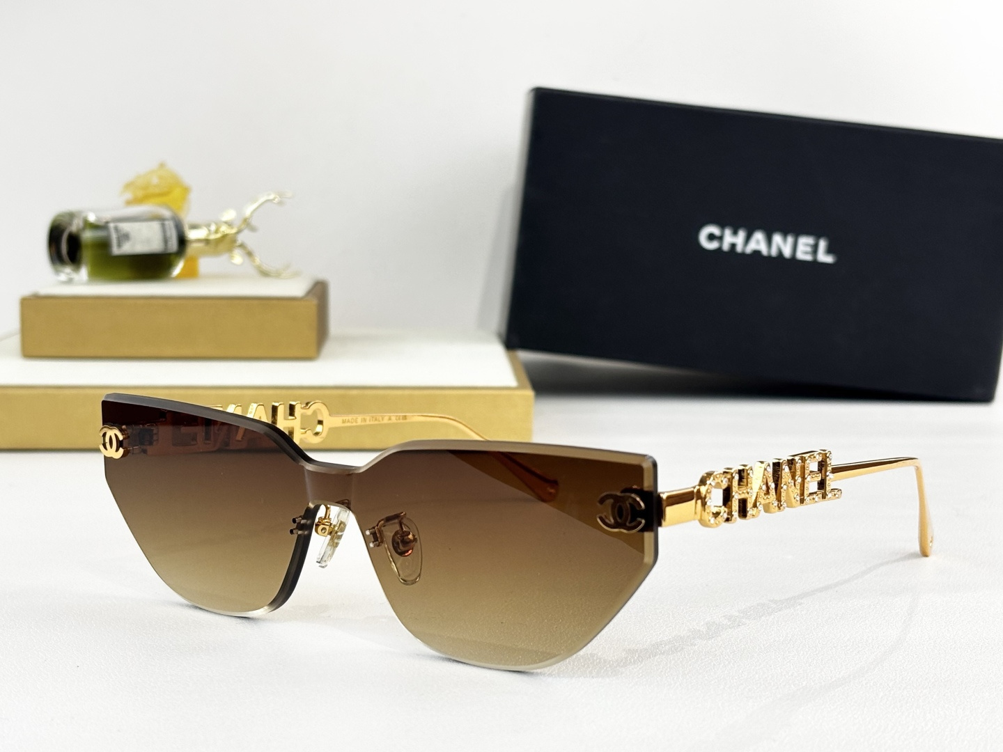 Chanel Luxury Rimless Cat-Eye Sunglasses - Gold Crystal Logo