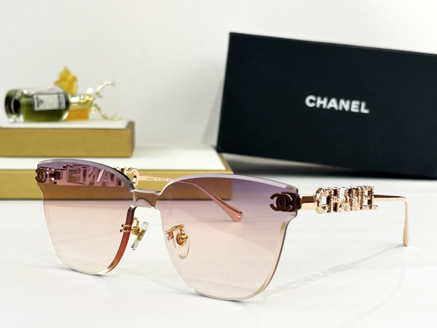 Chanel Butterfly Rimless Sunglasses - Luxury Gold Metal Logo