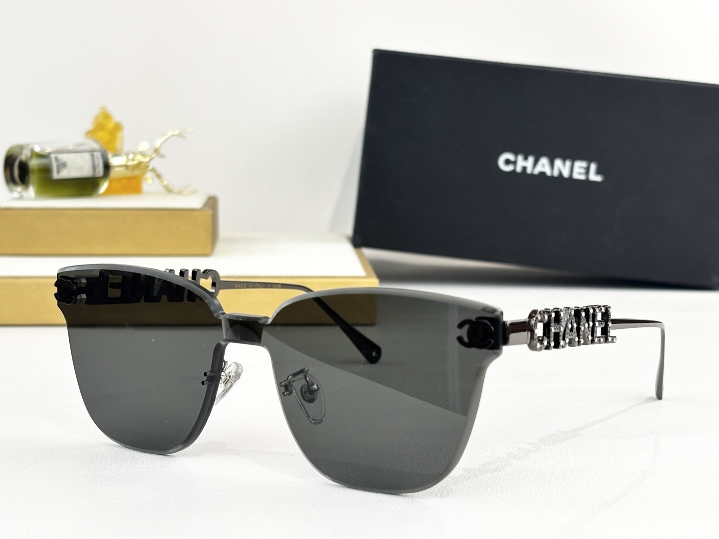 Chanel Butterfly Rimless Sunglasses - Luxury Gold Metal Logo