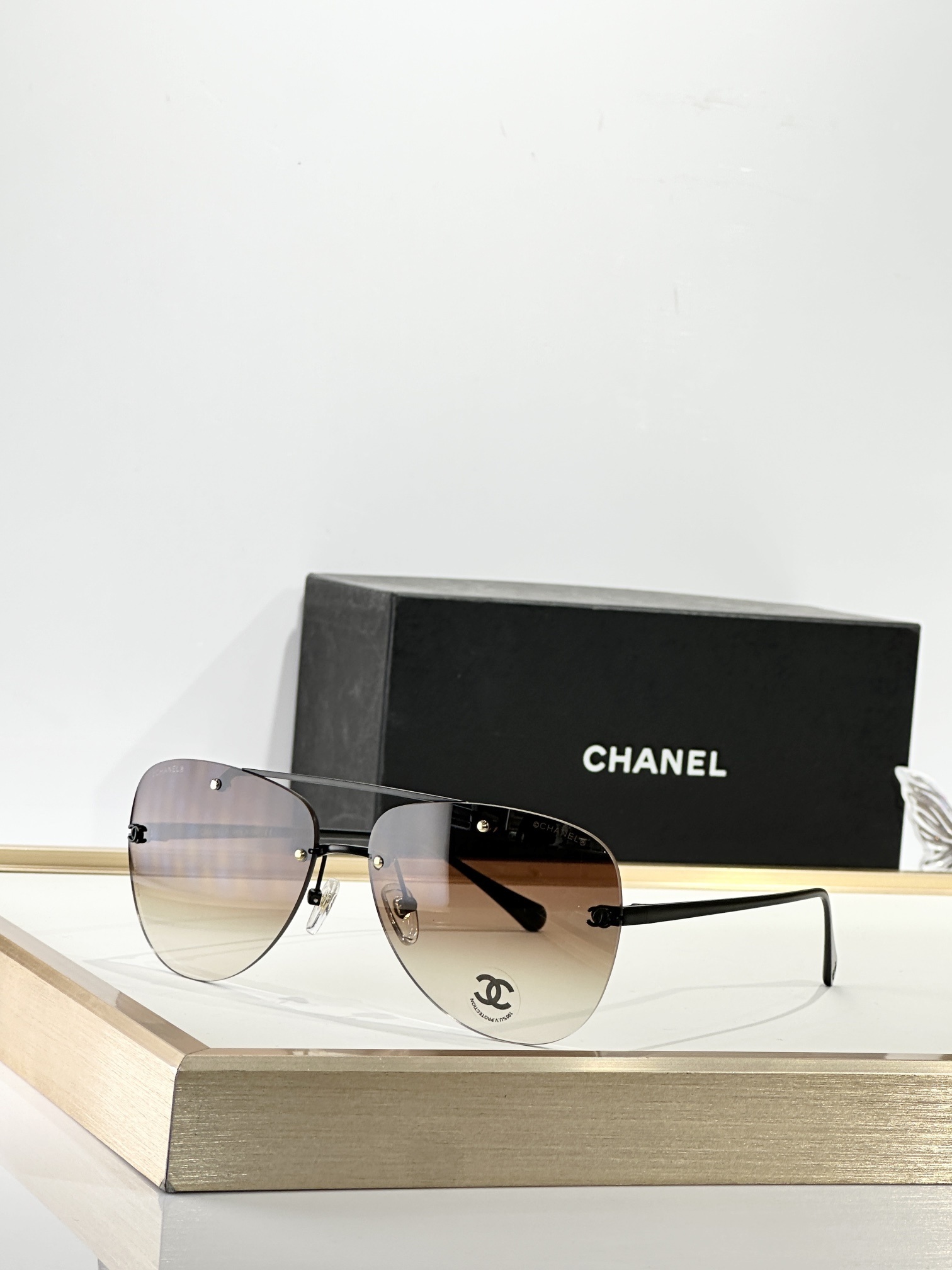 Chanel Luxury Rimless Aviator Eyewear - Elegant CC Logo Design