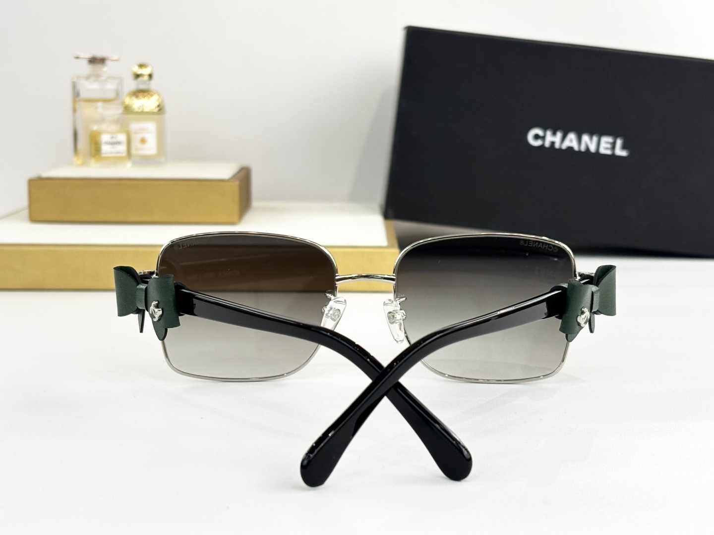Luxury Chanel Gold Metal Sunglasses with Leather Bow & CC Logo