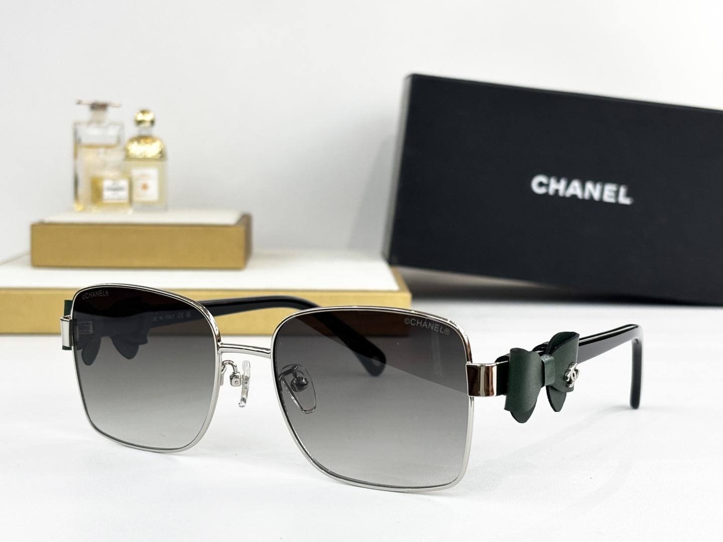 Luxury Chanel Gold Metal Sunglasses with Leather Bow & CC Logo