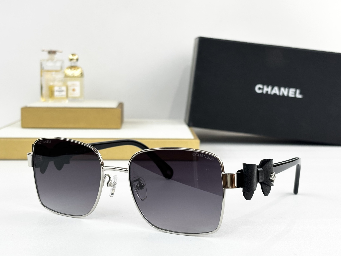 Luxury Chanel Gold Metal Sunglasses with Leather Bow & CC Logo