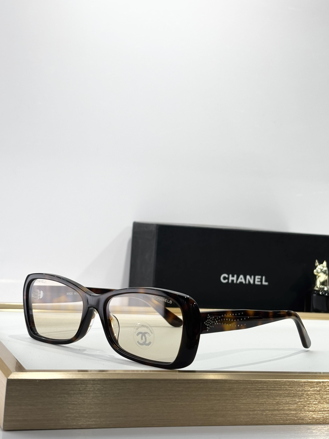 Chanel Luxury Rectangular Eyeglasses with Crystal Temple Detail