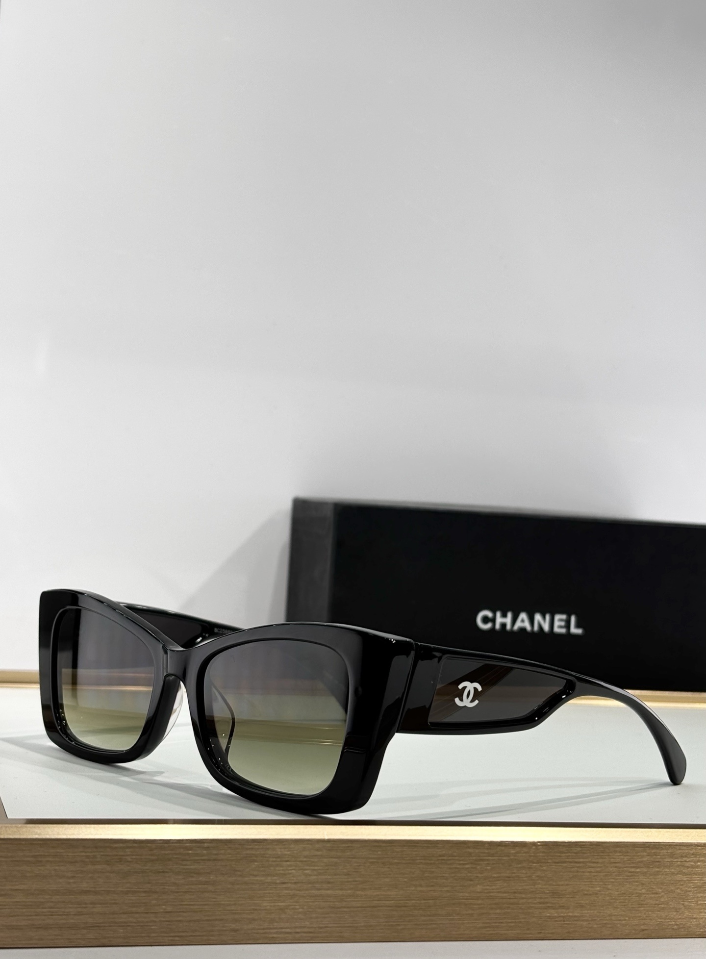 Chanel Luxury Butterfly Sunglasses - Elegant Black Frame & Tinted Lenses