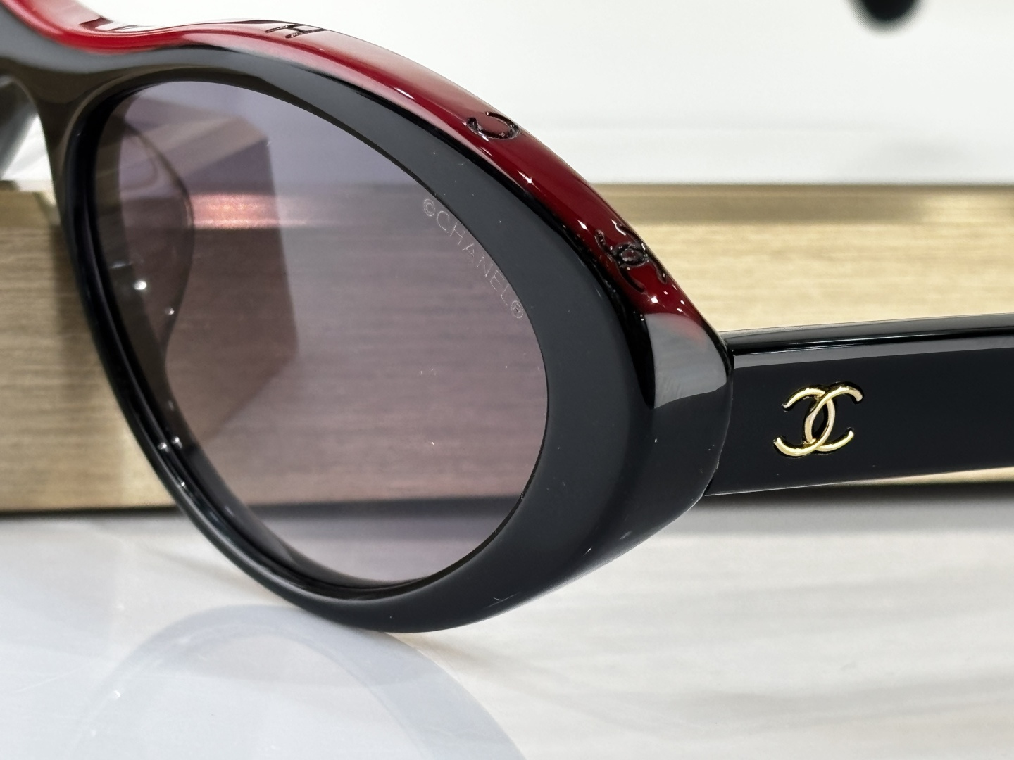 Chanel Oval Sunglasses in Black and Red Acetate Luxury Eyewear