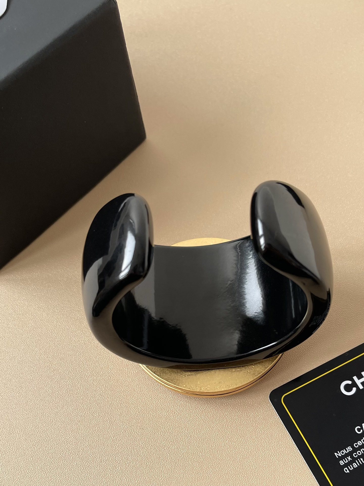 Chanel CC Logo Black Resin Cuff Bracelet with Red Crystal Medallion