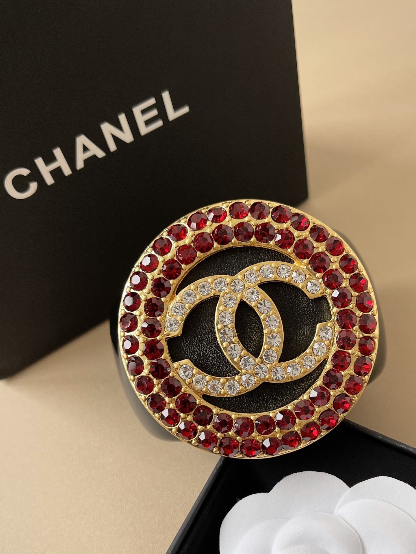 Chanel CC Logo Black Resin Cuff Bracelet with Red Crystal Medallion