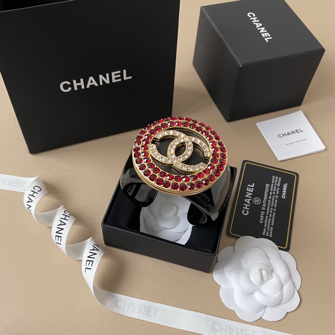 Chanel CC Logo Black Resin Cuff Bracelet with Red Crystal Medallion