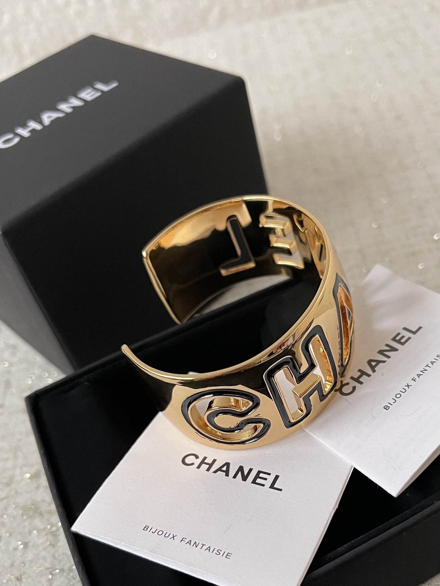 Chanel Luxury Gold-Tone Logo Cuff Bracelet with Black Enamel