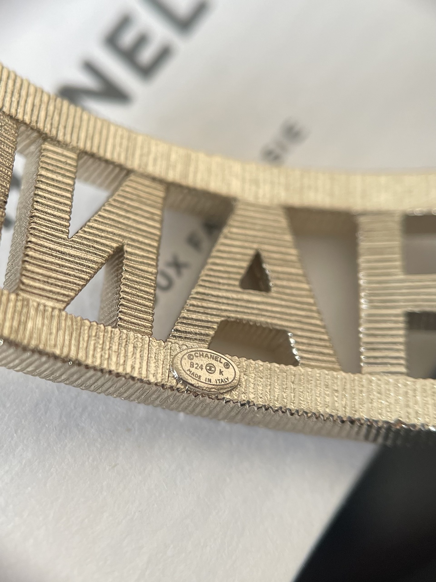 Elegant Crystal Logo Encrusted Gold Metal Wide Cuff Bracelet