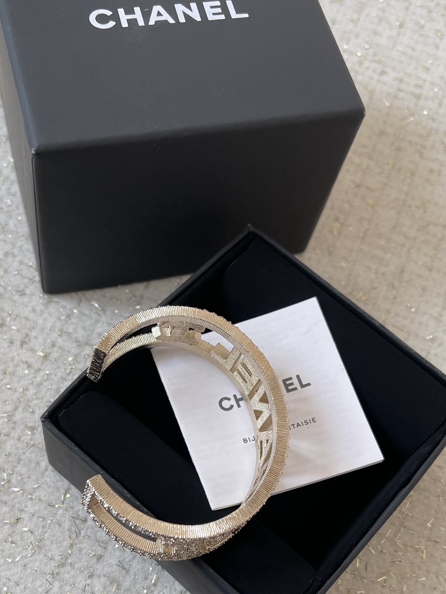 Elegant Crystal Logo Encrusted Gold Metal Wide Cuff Bracelet