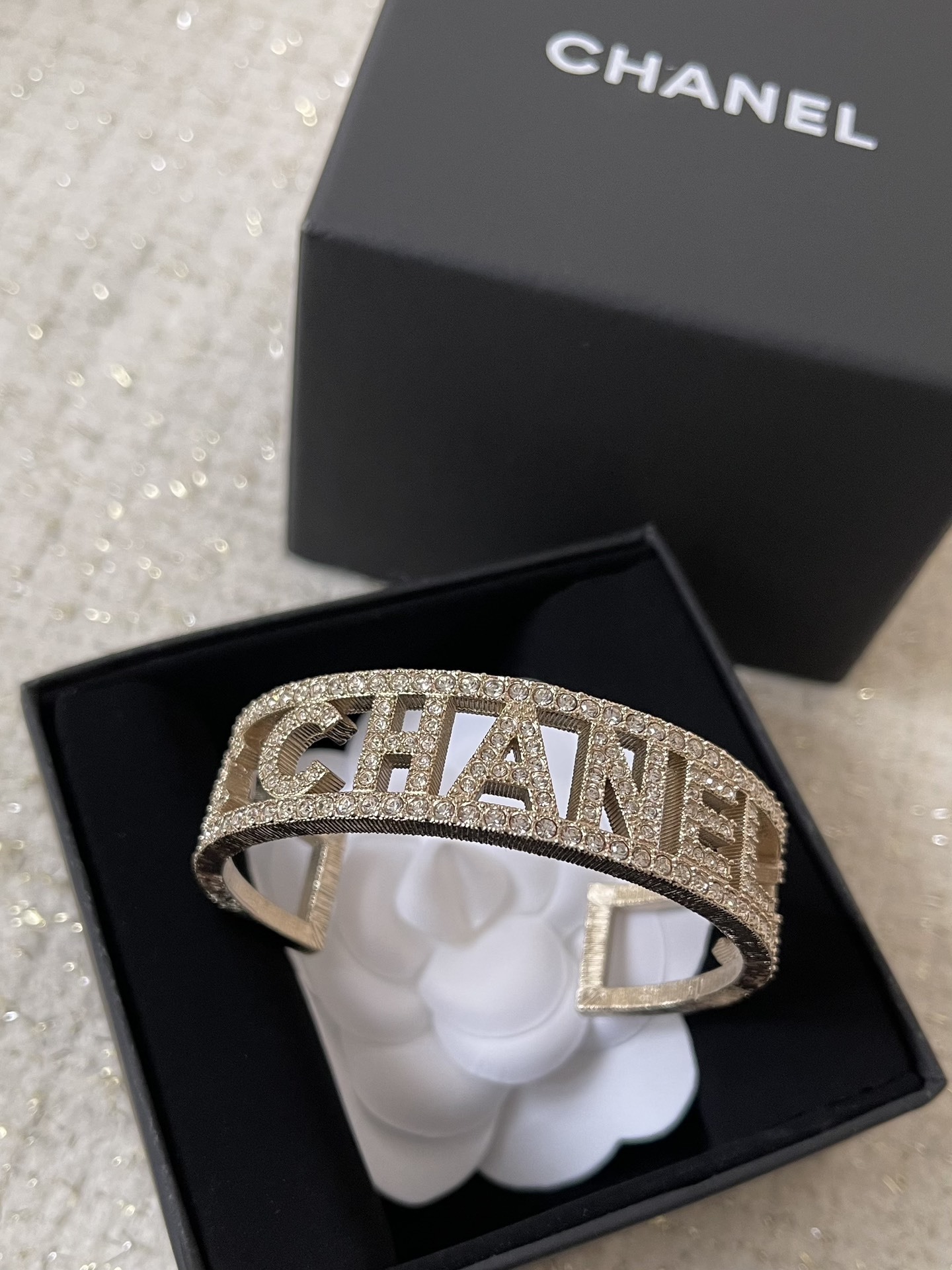 Elegant Crystal Logo Encrusted Gold Metal Wide Cuff Bracelet